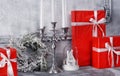 Christmas background concept. Ancient fireplace with a candlestick and gift boxes. Royalty Free Stock Photo