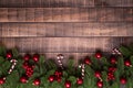 Christmas background concept. Top view of Christmas gift box red sock with spruce branches, pine cones, red berries Royalty Free Stock Photo