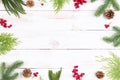 Christmas background concept. Top view of Christmas gift box with spruce branches, pine cones, red berries and bell Royalty Free Stock Photo