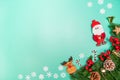 Christmas background concept. Top view of Christmas decoration, Santa Claus and reindeer with red gift box on green background Royalty Free Stock Photo