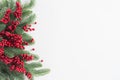Christmas background concept. Top view of Christmas gift box red balls with spruce branches, pine cones, red berries and bell on Royalty Free Stock Photo