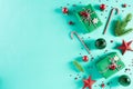 Christmas background concept. Top view of Christmas green gift box with candy cane decoration, spruce branches, star, red berries Royalty Free Stock Photo