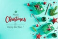 Christmas background concept. Top view of Christmas green gift box with candy cane decoration, spruce branches, star, red berries Royalty Free Stock Photo