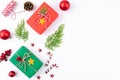 Christmas background concept. Top view of Christmas green and red gift box with spruce branches, pine cones Royalty Free Stock Photo