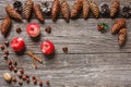 Christmas background with cones, red apples, Christmas stars a