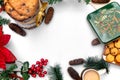 Christmas background with cookies, cup of coffee and christmas decorations on white, top view Royalty Free Stock Photo