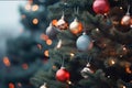 Christmas background with copy space. Branches of green New Year tree decorated with red blue golden balls and glowing Royalty Free Stock Photo