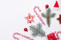 Christmas background with copyspace, candy and new year red decor on white background Royalty Free Stock Photo