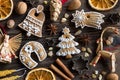 Christmas background with decorated gingerbread cookies and straw ornaments on wood Royalty Free Stock Photo