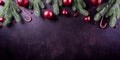 Christmas background decoration concept. Top view of red balls with spruce branches, pine cones, red berries and bell on dark Royalty Free Stock Photo