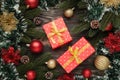 Christmas background with decorations and gift boxes on black wooden background Royalty Free Stock Photo