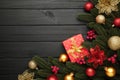 Christmas background with decorations and gift boxes on black wooden background Royalty Free Stock Photo