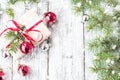 Christmas background with decorations snow and gift boxes on white wooden board Royalty Free Stock Photo