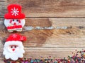 Christmas background decorations with Snowman and gift boxes on the old wood board by Flat lay, top view and copy space Royalty Free Stock Photo