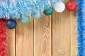 Christmas background with decorations on wooden board with copy space for text. New year theme for postcards. Wooden background
