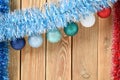 Christmas background with decorations on wooden board with copy space for text. New year theme for postcards. Wooden background