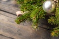 Christmas background with decorations on wooden board. New Year pine branch decore.