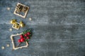 Christmas background with decorative composition of wooden frame, pine cone and snowflakes on wooden board. Happy new year. Card.