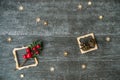 Christmas background with decorative composition of wooden frame, pine cone and snowflakes on wooden board. Happy new year. Card.