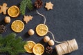 Christmas background, dried orange, cones, nuts and cookies, natural decorations for christmas tree