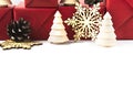 Christmas background with eco natural decoration over white wooden table. Wooden fir trees, snowflakes and pine cone Royalty Free Stock Photo