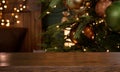 Christmas background. Empty wooden table on the background of the Christmas tree and New Year`s golden bokeh.Ready for product Royalty Free Stock Photo