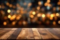 Christmas background. Empty wooden table on the background of the New Year\'s golden bokeh. Ready for product montage.