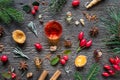 Christmas background with essential oil bottles, frankincense, myrrh, wintergreen and Christmas spices