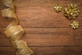 Christmas Background of fancy gold ribbon with bows on worn wooden planks