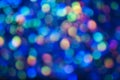 Christmas background. Festive glowing color overflows. Defocused chaotic circles Blurred bokeh
