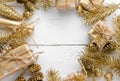 Christmas background with festive golden ornament on white wooden background. Greeting card.