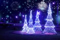 Christmas background. Festive night city lights and decorations on the street. Lighting on Christmas scenery tree, snow and Royalty Free Stock Photo