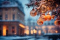 Christmas background with a fir branch with Christmas decorations and a panorama of the festive city in the background