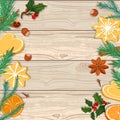 Christmas background. Fir branches, cookies and oranges on a wooden background Royalty Free Stock Photo