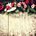 Christmas background with fir branches and decorations with Santa Claus clothes Royalty Free Stock Photo