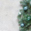 Christmas background with fir branches and decorations toys on a gray, festive mood, gift season. Winter holidays concept. Royalty Free Stock Photo