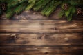 Christmas background with fir branches on vintage wooden backdrop top view. Yuletide floral frame Royalty Free Stock Photo