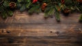 Christmas background with fir branches on vintage wooden backdrop top view. Yuletide floral frame Royalty Free Stock Photo