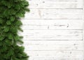 Christmas background with fir branches on white wooden board with copy space. Top view Royalty Free Stock Photo