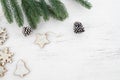 Christmas background - fir leaves and rustic elements decorating on white wood Royalty Free Stock Photo