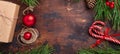 Christmas background with fir tree branch, gifts, candy canes and present box on wooden background. Flat lay, top view, copy space Royalty Free Stock Photo