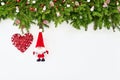 Christmas background. Christmas fir tree branch with Santa on white wooden background. Copy space Royalty Free Stock Photo