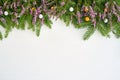 Christmas background. Fir tree branches and common heather flowers with decoration on white background. Copy space, top view Royalty Free Stock Photo