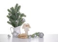 Christmas background with fir tree branches in the vase, gift boxes and angel figurine Royalty Free Stock Photo