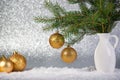 Christmas background with fir tree branches in the vase and golden balls Royalty Free Stock Photo