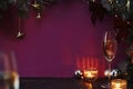 Christmas background with fir tree, champagne in glasses and decoration on dark wooden board, celebration at home Royalty Free Stock Photo