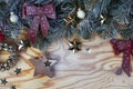 Christmas background with fir tree and decoration on light wooden board from above Royalty Free Stock Photo