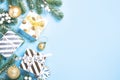 Christmas background - fir tree and decorations on blue top view Royalty Free Stock Photo