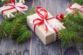 Christmas background with fir tree and decorations and gift boxes on wooden board Royalty Free Stock Photo