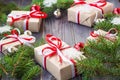 Christmas background with fir tree and decorations and gift boxes on wooden board Royalty Free Stock Photo